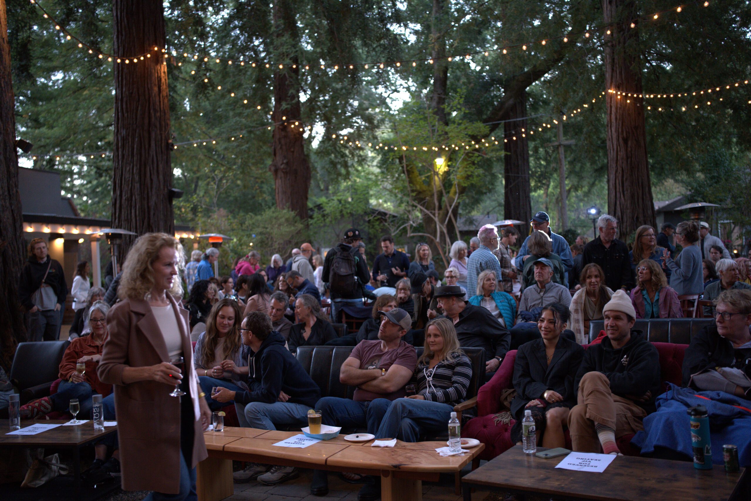 Team gathering under redwoods at Redwood Event Center