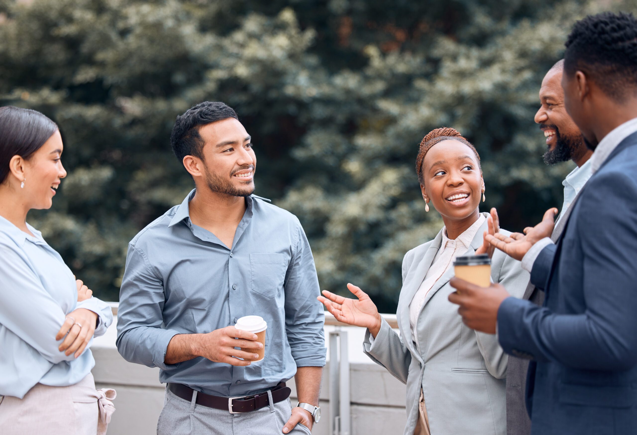 Bay Area professionals networking outdoors on a deck with drinks
